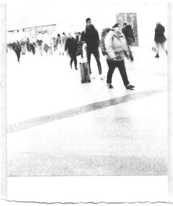 A black and white pocket printer style photo of a crowd of people